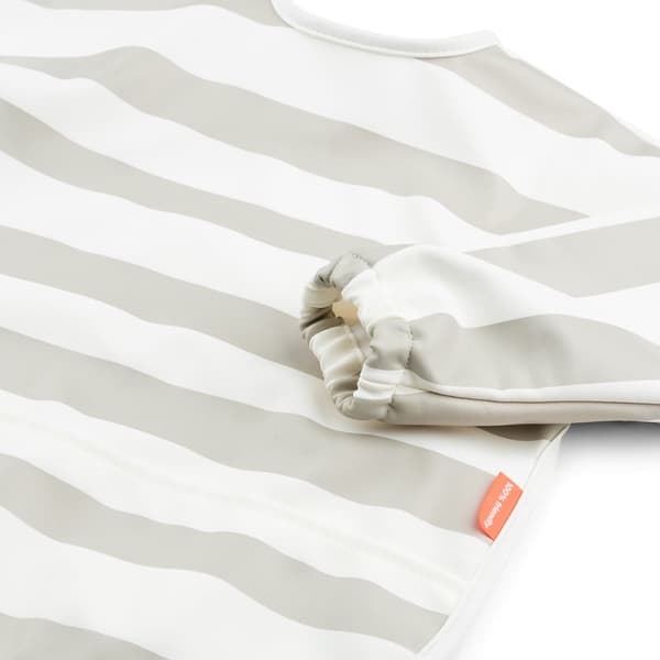 Done by Deer Sleeved pocket bib Stripes Sand