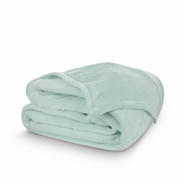 Mintgrön filt 150x200 fluffig korallfärgad tyg mjuk och behaglig vid beröring