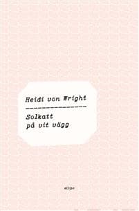 Solkatt på vit vägg