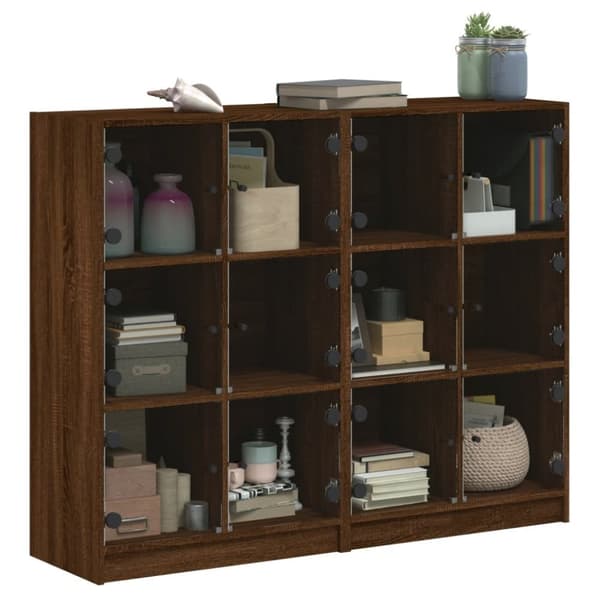 vidaXL bogreol med låger 136x37x109 cm konstrueret træ brunt eg