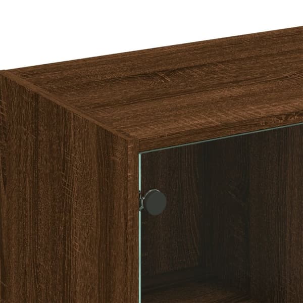 vidaXL bogreol med låger 136x37x109 cm konstrueret træ brunt eg