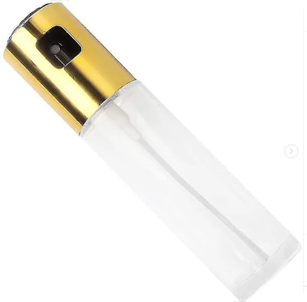 Glasflaska med en olivolja spruta och ett guldlock