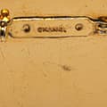 Miniatyrbilde 3 av 3: Pre-owned Chanel Gold Plated and Enamel Round Coco Paris Brooch Gold