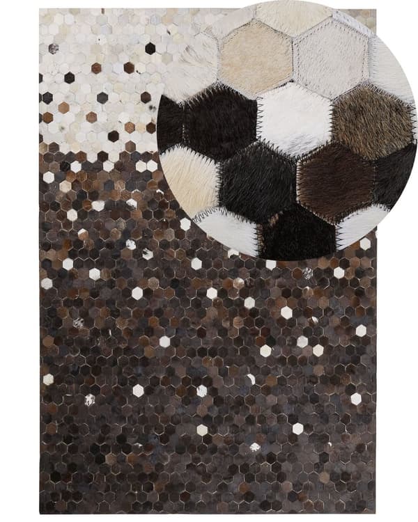 Matto beige ruskea lehmännahka 140 x 200 cm käsintehty geometrinen kuvio industriaalinen tyyli
