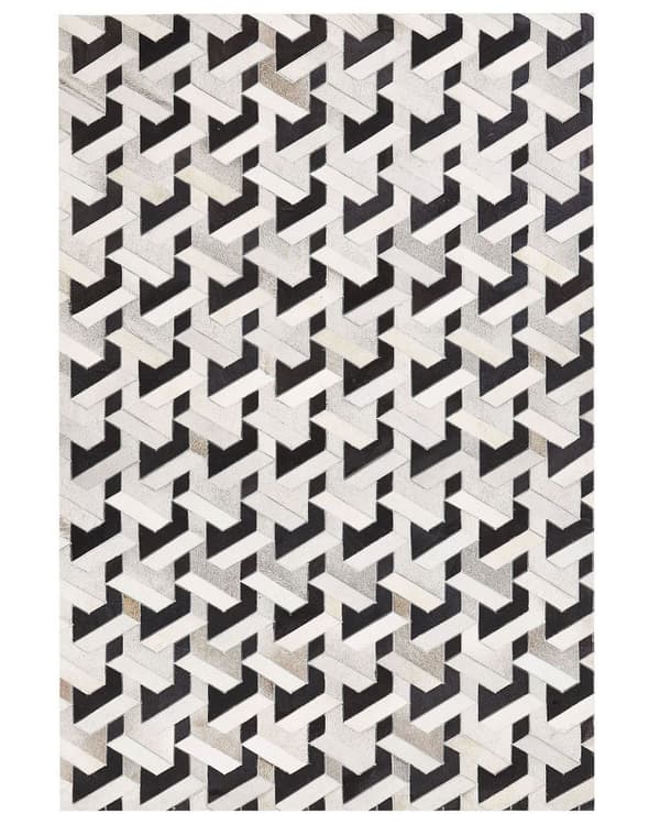 Teppe i svart og hvitt kuskinn 160 x 230 cm Geometrisk mønster med lappeteppe
