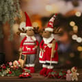 Miniatyrbillede 2 af 2: JULEPYNTEDUKKE 18 X 14 X 62 CM RØD