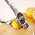 Miniatyrbild 2 av 5: Citronpress i rostfritt stål Manuell citronklämma