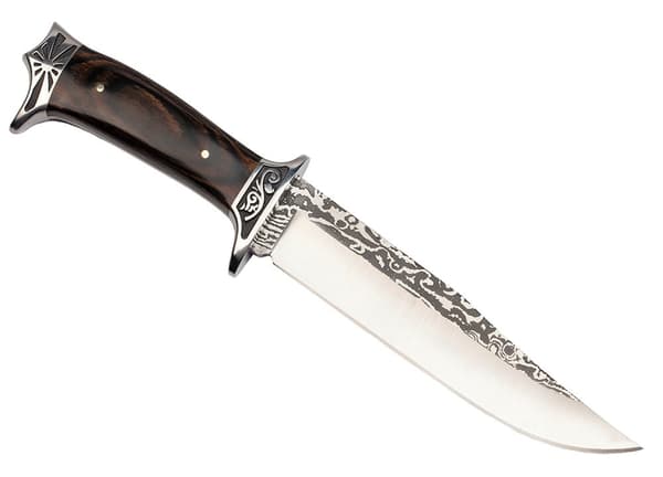 Stor N-182 Columbia jaktkniv med dekorativ gravyr och slida