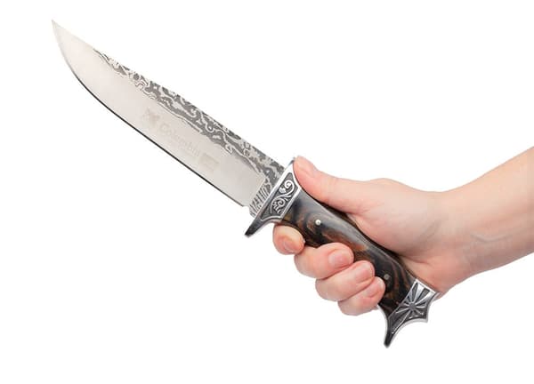 Stor N-182 Columbia jaktkniv med dekorativ gravyr och slida