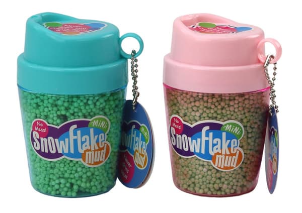 Squishy frigolitbollar i en grön kopp