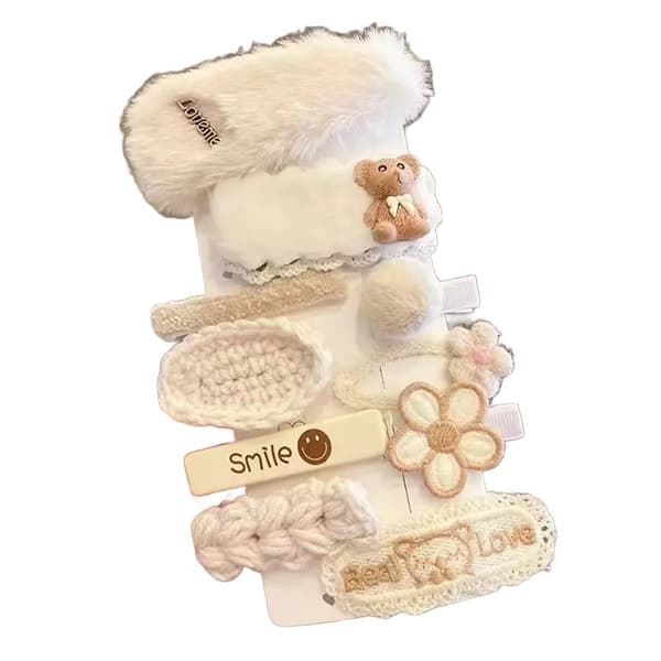 Et sæt pigelige beige hårspænder og stifter, type XIX