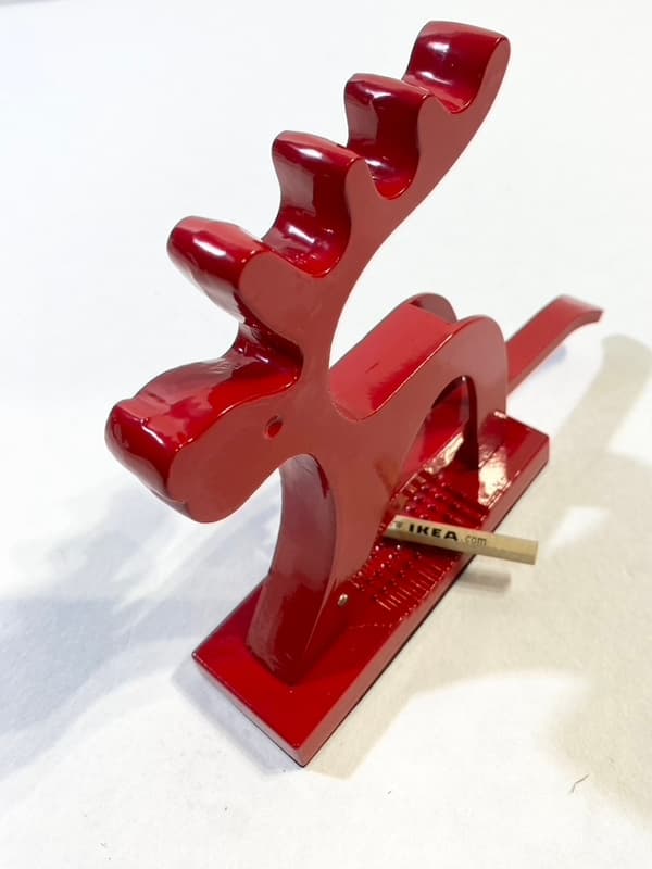 Red nutcracker in the shape of a reindeer in modern lines2-pack