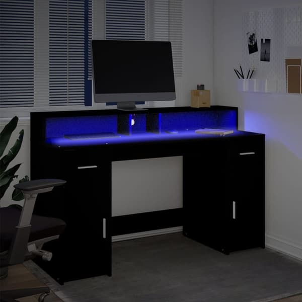 Skrivbord med LED svart 140x55x91 cm konstruerat trä