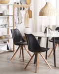 Miniatyrbild 2 av 8: Middagsstol Svart Konstläder Sits Elegant Träben Modern