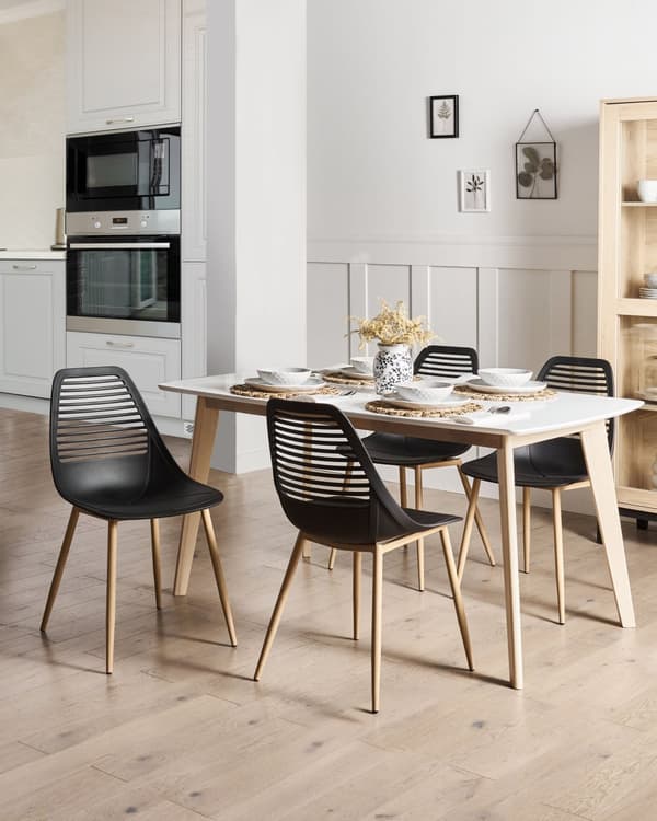 Sæt med 4 spisebordsstole sort syntetisk sæde metalben moderne minimalistisk stil køkken spisestue