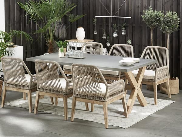 Utendørs spisegruppe Grå Bord i betong 6 flettede stoler Sitteputer Moderne design Hagemøbler