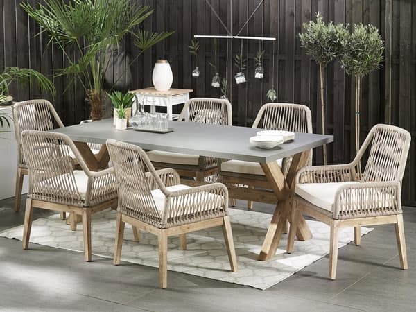 Utendørs spisegruppe Grå Bord i betong 6 flettede stoler Sitteputer Moderne design Hagemøbler