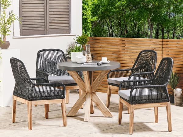 Utendørs spisegruppe Grå Svart Bord i betong 4 flettede stoler Sitteputer Moderne design Hagemøbler