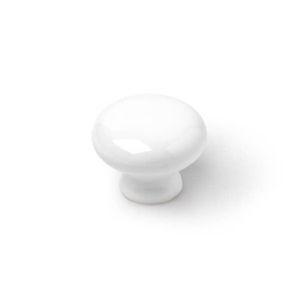 Blisterförpackning innehållande 4 runda vita porslinsmöbelknoppar mod.821 ø35mm rei.