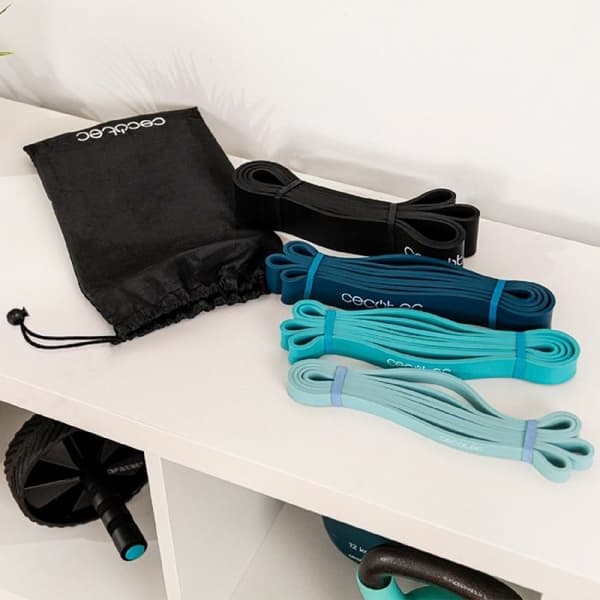 Set med 4 elastiska band - DrumFit - Motstånd 15-60 kg - Latex - Transportväska