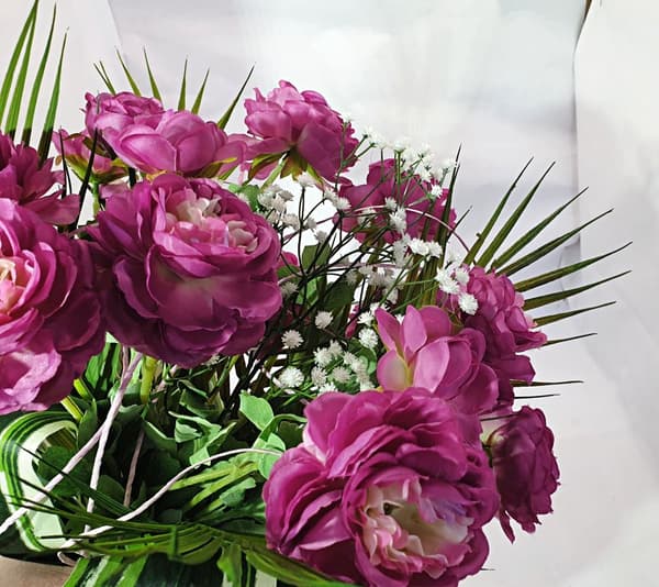 BEGRAVELSESBUS BLOMSTER TIL GRUSBUKETT TIL EN VASE
