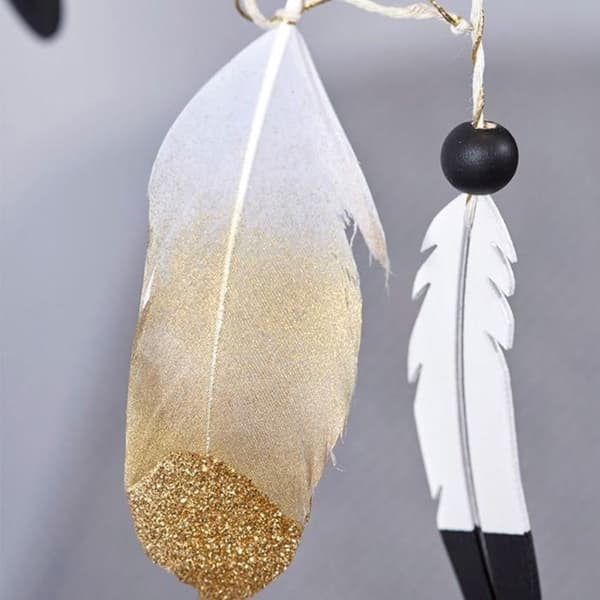 12 gyllene glitterfjädrar