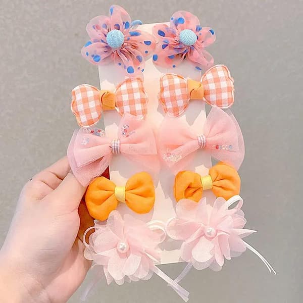 Sett med fargerike buer hårklips blomster perler