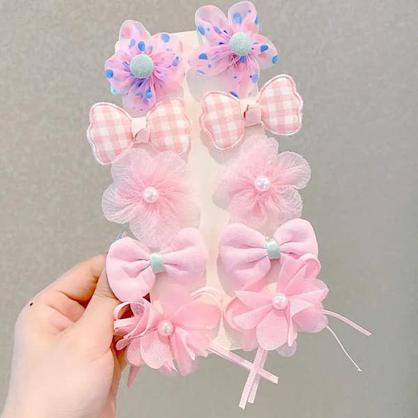 Sett med fargerike buer hårklips blomster perler