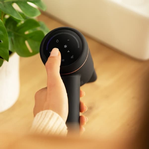 Cecotec Dryer with digital motor and real ion, digital touch display, and magnetic accessories.