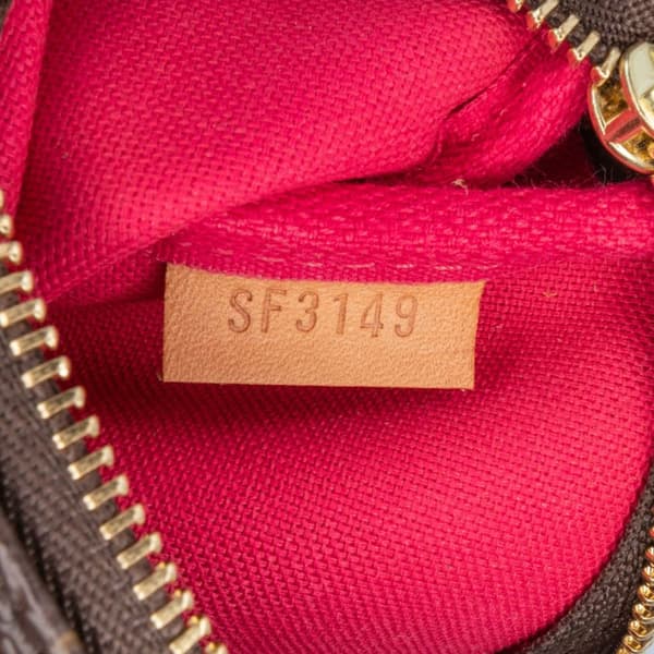 Pre-owned Louis Vuitton Monogram Christmas Animation Mini Courchevel Pochette Accessories Brown