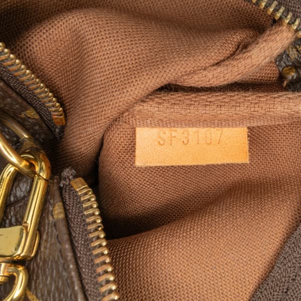 Pre-owned Louis Vuitton Monogram Giraffe Christmas Mini Pochette Accessoires Brown