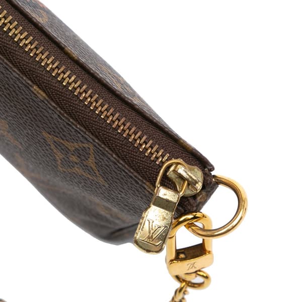 Pre-owned Louis Vuitton Monogram Giraffe Christmas Mini Pochette Accessoires Brown