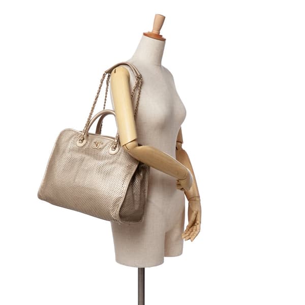 Pre-owned Chanel Perforated Metallic Calfskin Up In The Air Tote Gold