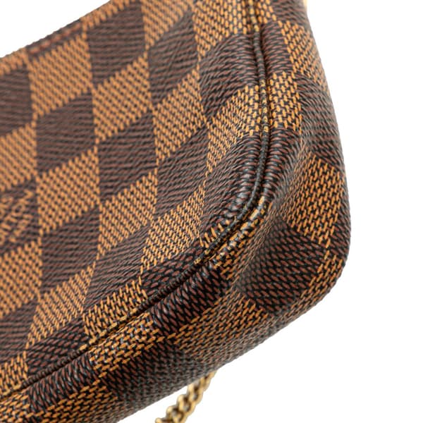 Pre-owned Louis Vuitton Damier Ebene Mini Pochette Accessoires Brown
