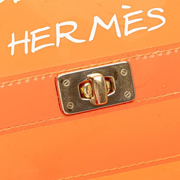 Pre-owned Hermès Vinyl Souvenir De L Exposition Kelly Handbag Orange
