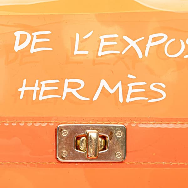Pre-owned Hermès Vinyl Souvenir De L Exposition Kelly Handbag Orange