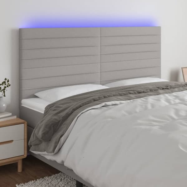 sengegavl med LED-lys 200x5x118/128 cm stof lysegrå