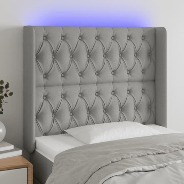 sengegavl med LED-lys 93x16x118/128 cm stof lysegrå