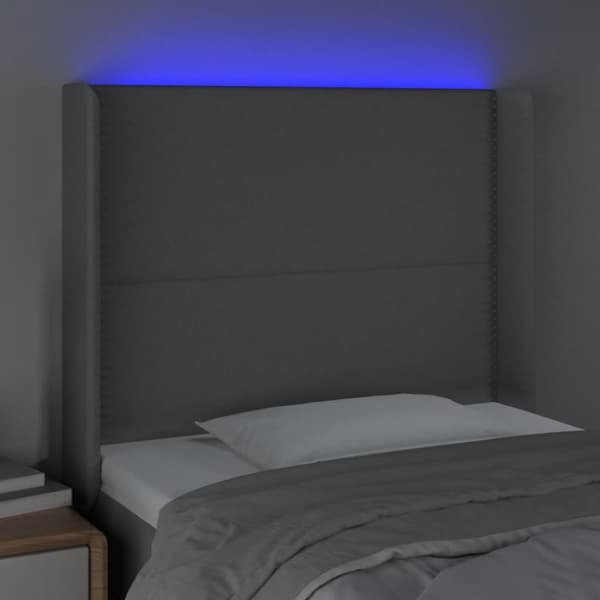 sengegavl med LED-lys 103x16x118/128 cm stof lysegrå