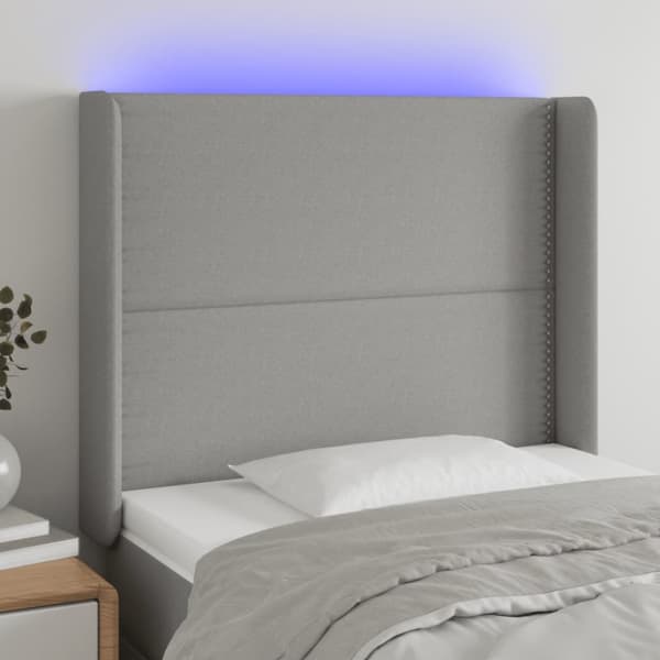sengegavl med LED-lys 103x16x118/128 cm stof lysegrå