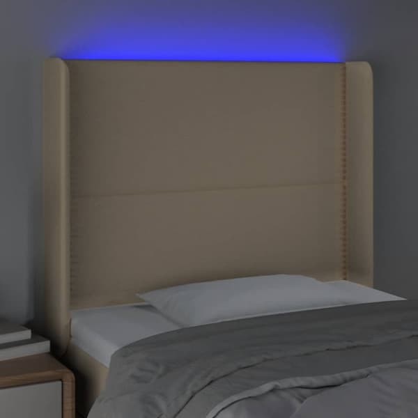sengegavl med LED-lys 103x16x118/128 cm stof cremefarvet