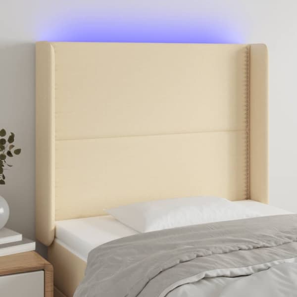 sengegavl med LED-lys 103x16x118/128 cm stof cremefarvet