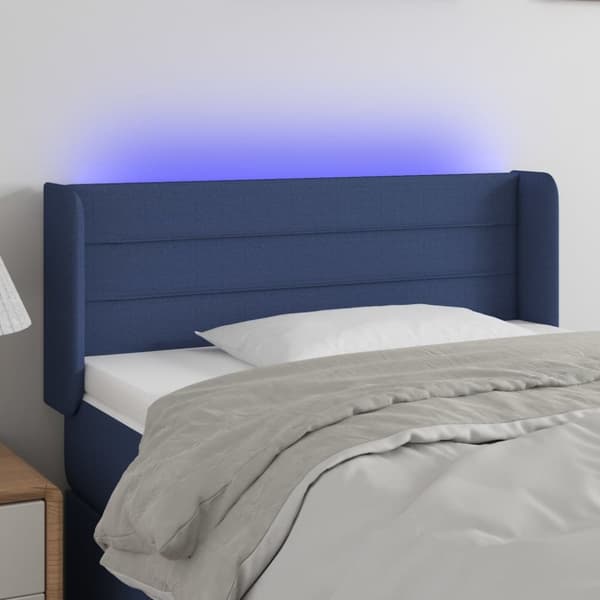 sengegavl med LED-lys 83x16x78/88 cm stof blå
