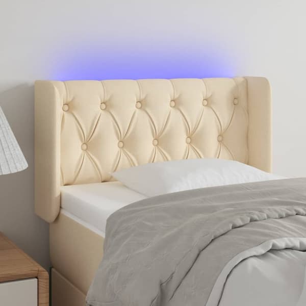 sengegavl med LED-lys 83x16x78/88 cm stof cremefarvet