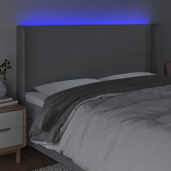 sengegavl med LED-lys 203x16x118/128 cm stof lysegrå
