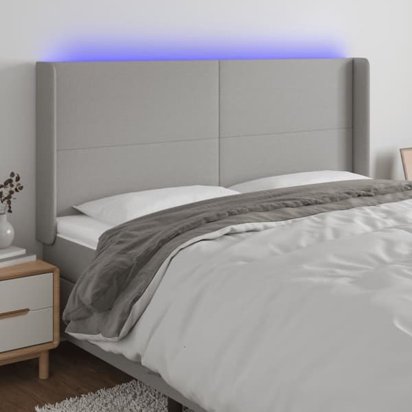 sengegavl med LED-lys 203x16x118/128 cm stof lysegrå
