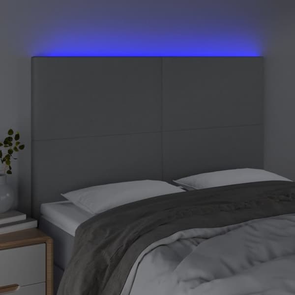 sengegavl med LED-lys 144x5x118/128 cm stof lysegrå