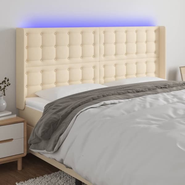 sengegavl med LED-lys 203x16x118/128 cm stof cremefarvet