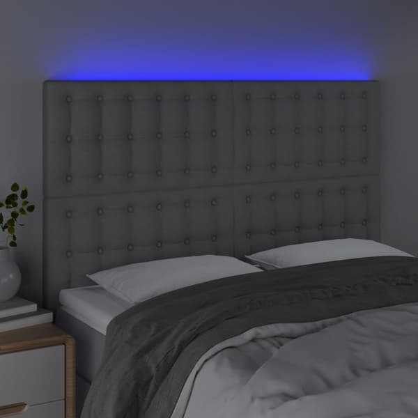 sengegavl med LED-lys 144x5x118/128 cm stof lysegrå