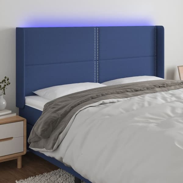 sengegavl med LED-lys 183x16x118/128 cm stof blå